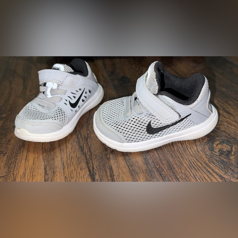 Nike infant tennis shoes size 4.